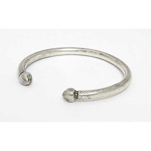 657 - A white metal torque bangle / bracelet