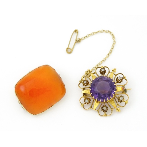 660 - A  Victorian yellow metal brooch of stylised star form set with amethyst seed pearl detail. Together... 