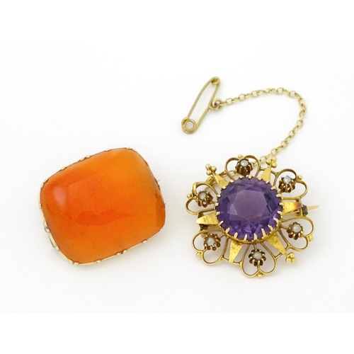 660 - A  Victorian yellow metal brooch of stylised star form set with amethyst seed pearl detail. Together... 