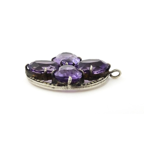 668 - Assorted jewellery to include a white metal pendant set with amethyst and marcasite detail, a brooch... 