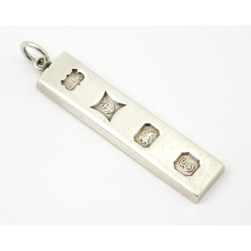 674 - A silver pendant of ingot form, hallmarked Birmingham 197.  Approx. 1 3/4