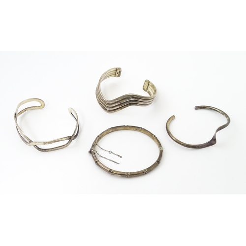 678 - Four assorted silver bracelets / bangles, to include one with bamboo detail hallmarked Birmingham 19... 