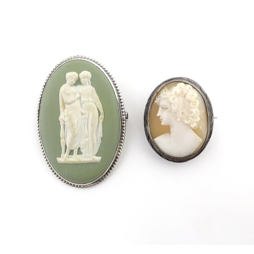 697 - A shell carved cameo brooch with white metal mount together with a brooch set with Wedgwood jasperwa... 