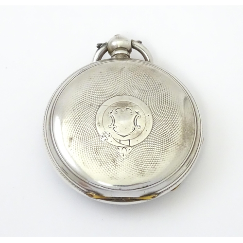 761 - A silver cased pocket watch with white enamel dial, Roman numerals and subsidiary seconds dial.  app... 