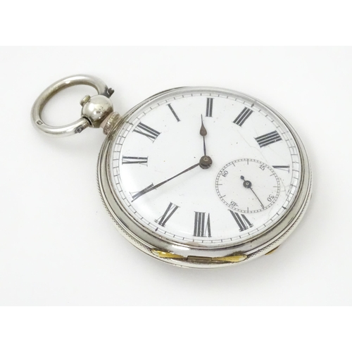 761 - A silver cased pocket watch with white enamel dial, Roman numerals and subsidiary seconds dial.  app... 