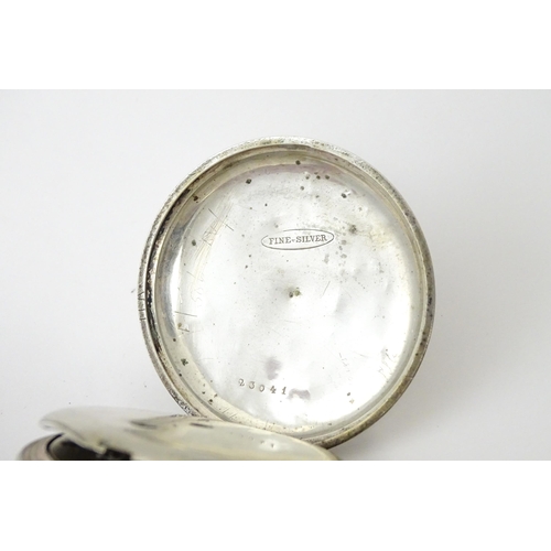 761 - A silver cased pocket watch with white enamel dial, Roman numerals and subsidiary seconds dial.  app... 