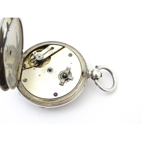 761 - A silver cased pocket watch with white enamel dial, Roman numerals and subsidiary seconds dial.  app... 