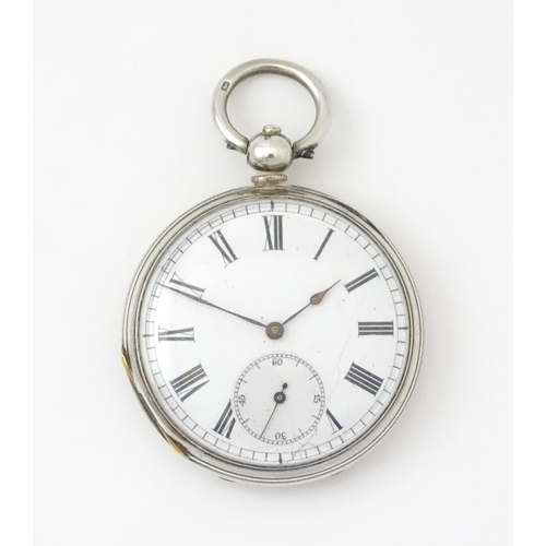 761 - A silver cased pocket watch with white enamel dial, Roman numerals and subsidiary seconds dial.  app... 