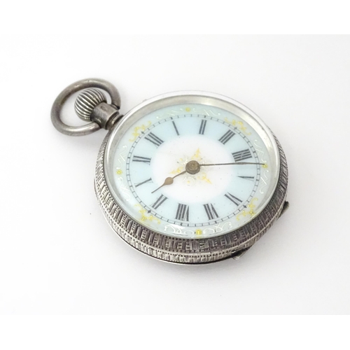 762 - A Swiss silver cased pocket / fob watch with enamel detail and Roman Numerals. Approx 1 /4