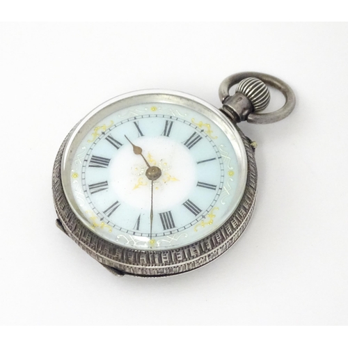 762 - A Swiss silver cased pocket / fob watch with enamel detail and Roman Numerals. Approx 1 /4