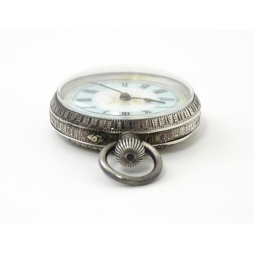 762 - A Swiss silver cased pocket / fob watch with enamel detail and Roman Numerals. Approx 1 /4