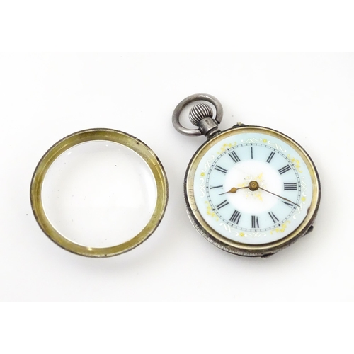 762 - A Swiss silver cased pocket / fob watch with enamel detail and Roman Numerals. Approx 1 /4