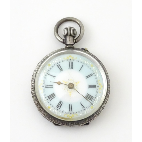 762 - A Swiss silver cased pocket / fob watch with enamel detail and Roman Numerals. Approx 1 /4