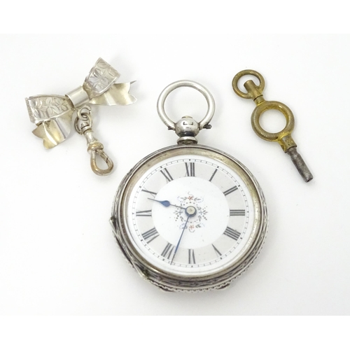 763 - A ladies pocket watch with bow formed brooch hanger. The brooch hallmarked Chester 1908 maker S Ward... 