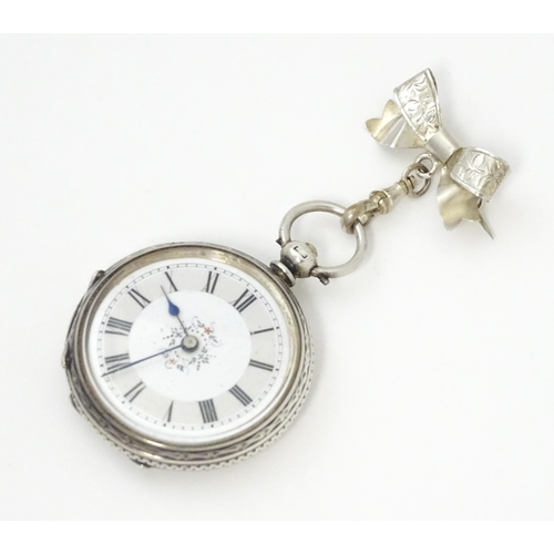 763 - A ladies pocket watch with bow formed brooch hanger. The brooch hallmarked Chester 1908 maker S Ward... 