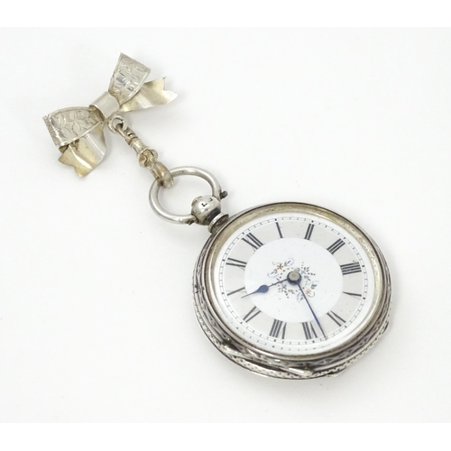 763 - A ladies pocket watch with bow formed brooch hanger. The brooch hallmarked Chester 1908 maker S Ward... 