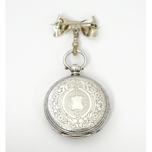 763 - A ladies pocket watch with bow formed brooch hanger. The brooch hallmarked Chester 1908 maker S Ward... 