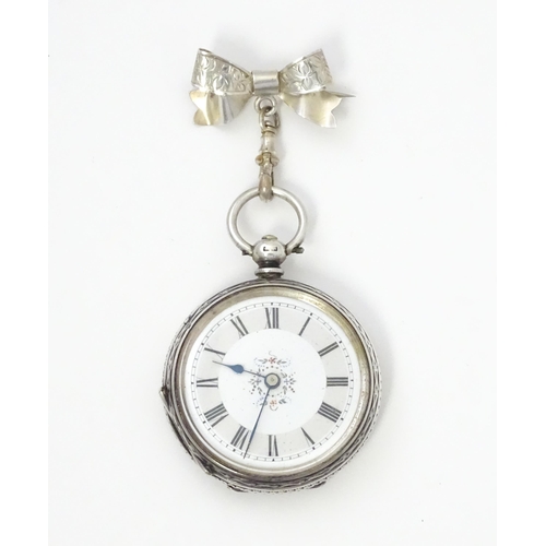 763 - A ladies pocket watch with bow formed brooch hanger. The brooch hallmarked Chester 1908 maker S Ward... 