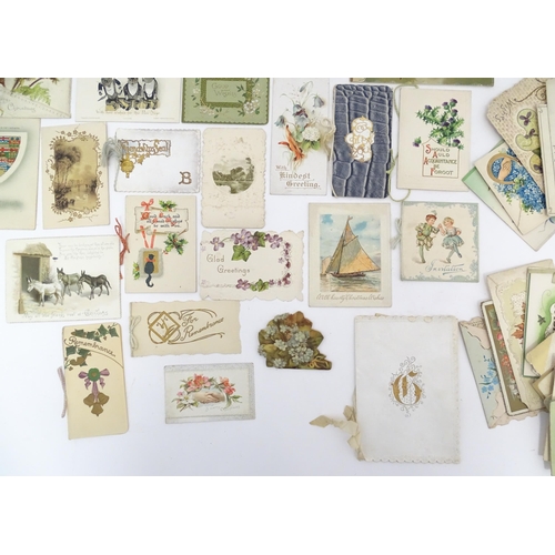 968 - A quantity of early 20thC greetings cards, Christmas cards, Birthday wishes, postcards, etc. Subject... 