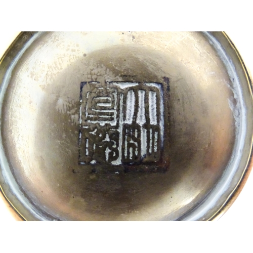 1001 - A Chinese cast brass pot decorated with phoenix, bat, stylised clouds, flowers, etc. Character marks... 