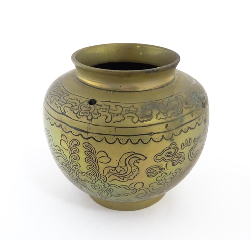 1001 - A Chinese cast brass pot decorated with phoenix, bat, stylised clouds, flowers, etc. Character marks... 