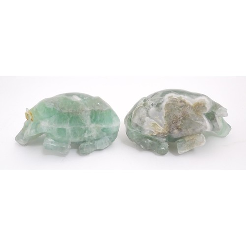 1017 - Two Chinese carved green fluorite models of recumbent buffalo, on wooden stands. Approx. 5