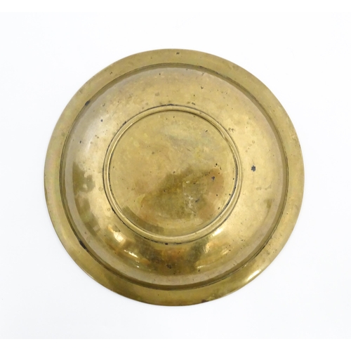 1037 - A Middle Eastern brass dish / bowl with incised detail and inlaid white metal and copper decoration ... 