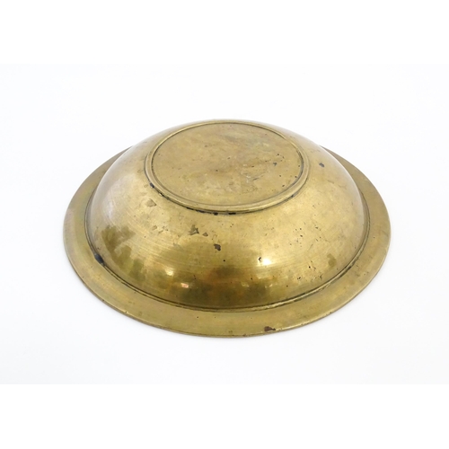 1037 - A Middle Eastern brass dish / bowl with incised detail and inlaid white metal and copper decoration ... 