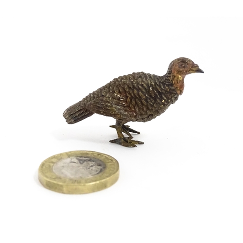 1052 - A cold painted bronze model of a game bird. Approx. 1 3/4