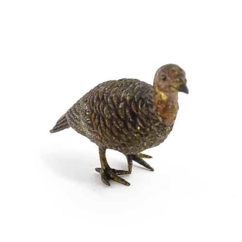 1052 - A cold painted bronze model of a game bird. Approx. 1 3/4