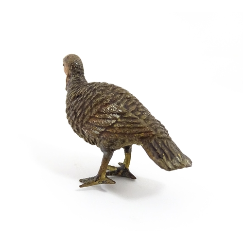 1052 - A cold painted bronze model of a game bird. Approx. 1 3/4