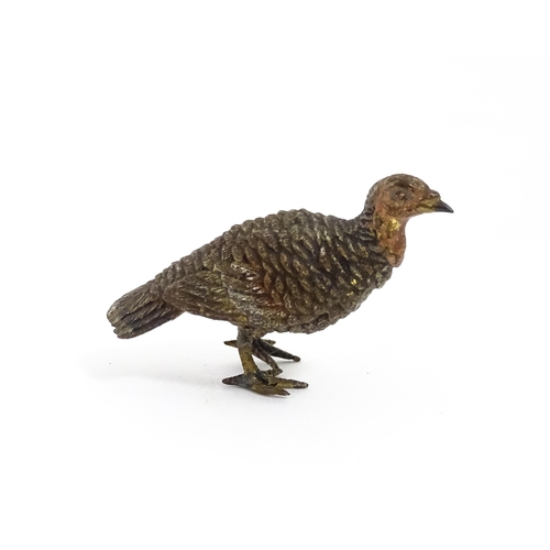 1052 - A cold painted bronze model of a game bird. Approx. 1 3/4