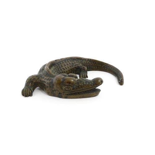 1054 - A 20thC cast bronze model of a crocodile / alligator. Approx. 5 1/4