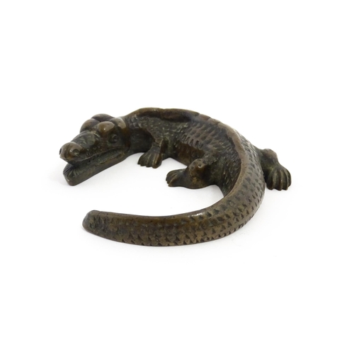 1054 - A 20thC cast bronze model of a crocodile / alligator. Approx. 5 1/4