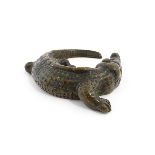 1054 - A 20thC cast bronze model of a crocodile / alligator. Approx. 5 1/4