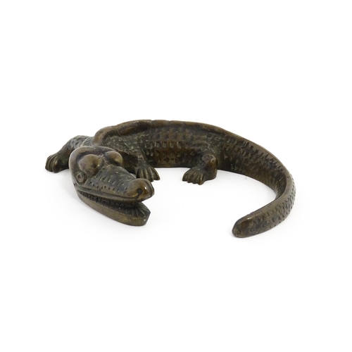 1054 - A 20thC cast bronze model of a crocodile / alligator. Approx. 5 1/4