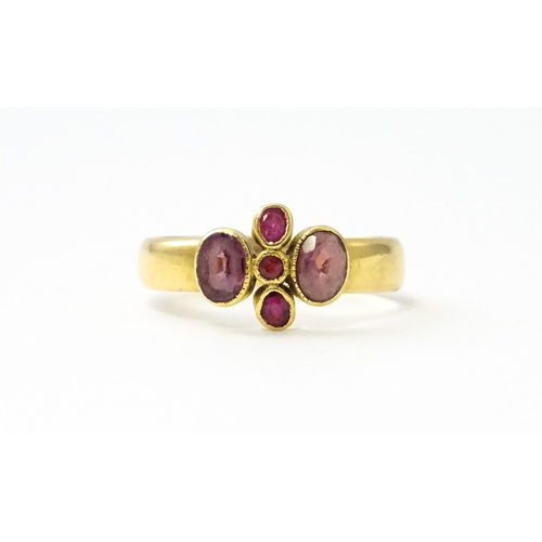 533 - A Victorian 18ct gold ring set with three rubies flanked by two amethysts, hallmarked Birmingham 189... 