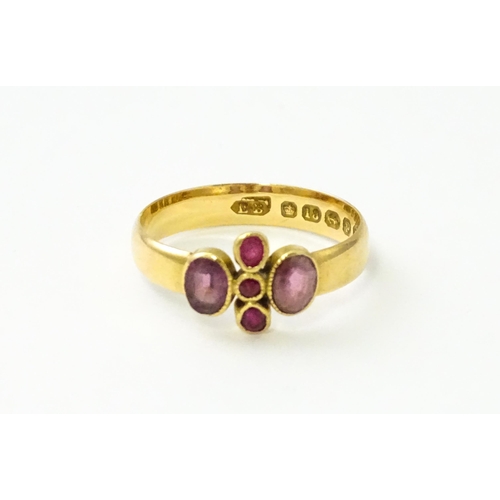 533 - A Victorian 18ct gold ring set with three rubies flanked by two amethysts, hallmarked Birmingham 189... 