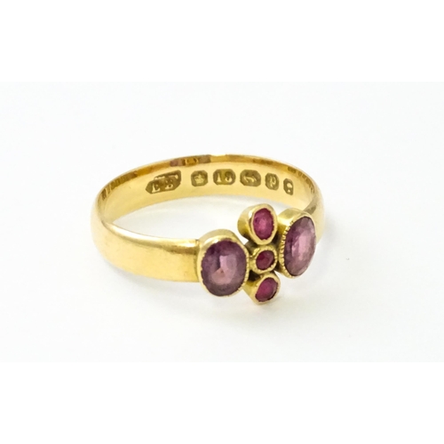 533 - A Victorian 18ct gold ring set with three rubies flanked by two amethysts, hallmarked Birmingham 189... 