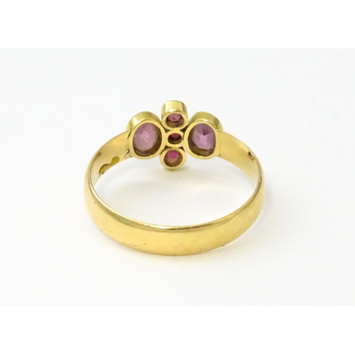 533 - A Victorian 18ct gold ring set with three rubies flanked by two amethysts, hallmarked Birmingham 189... 