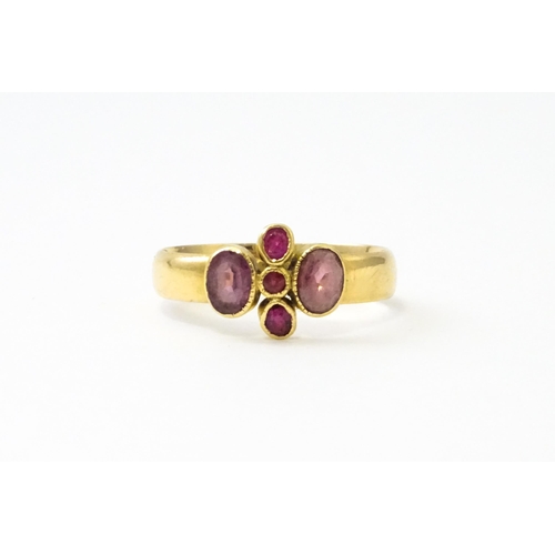 533 - A Victorian 18ct gold ring set with three rubies flanked by two amethysts, hallmarked Birmingham 189... 