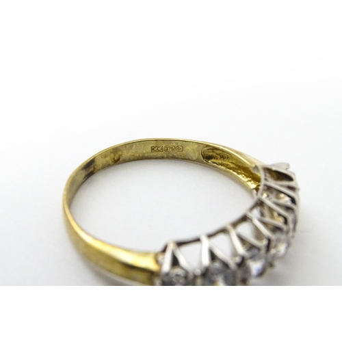 534 - A 9ct gold half eternity ring set with seven white stones. Ring size approx. Q