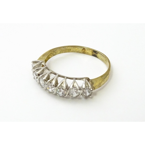 534 - A 9ct gold half eternity ring set with seven white stones. Ring size approx. Q