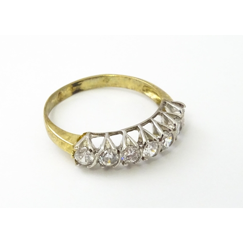 534 - A 9ct gold half eternity ring set with seven white stones. Ring size approx. Q