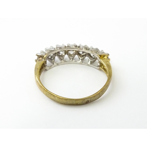 534 - A 9ct gold half eternity ring set with seven white stones. Ring size approx. Q