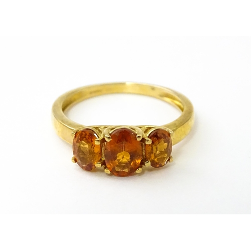 536 - A 9ct gold ring set with hessonite garnet. Ring size approx. N 1/2