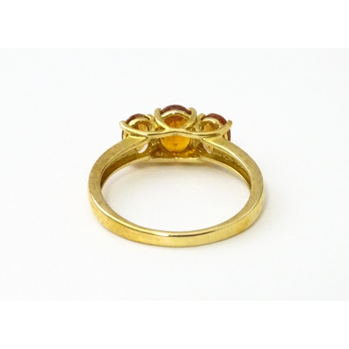 536 - A 9ct gold ring set with hessonite garnet. Ring size approx. N 1/2