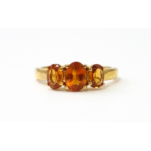 536 - A 9ct gold ring set with hessonite garnet. Ring size approx. N 1/2