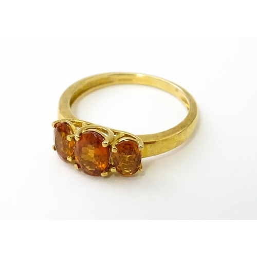 536 - A 9ct gold ring set with hessonite garnet. Ring size approx. N 1/2