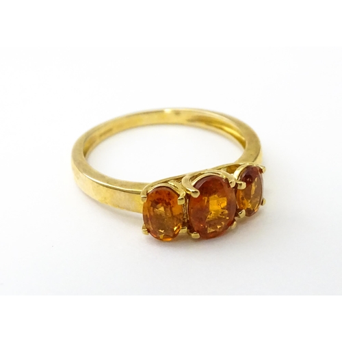 536 - A 9ct gold ring set with hessonite garnet. Ring size approx. N 1/2